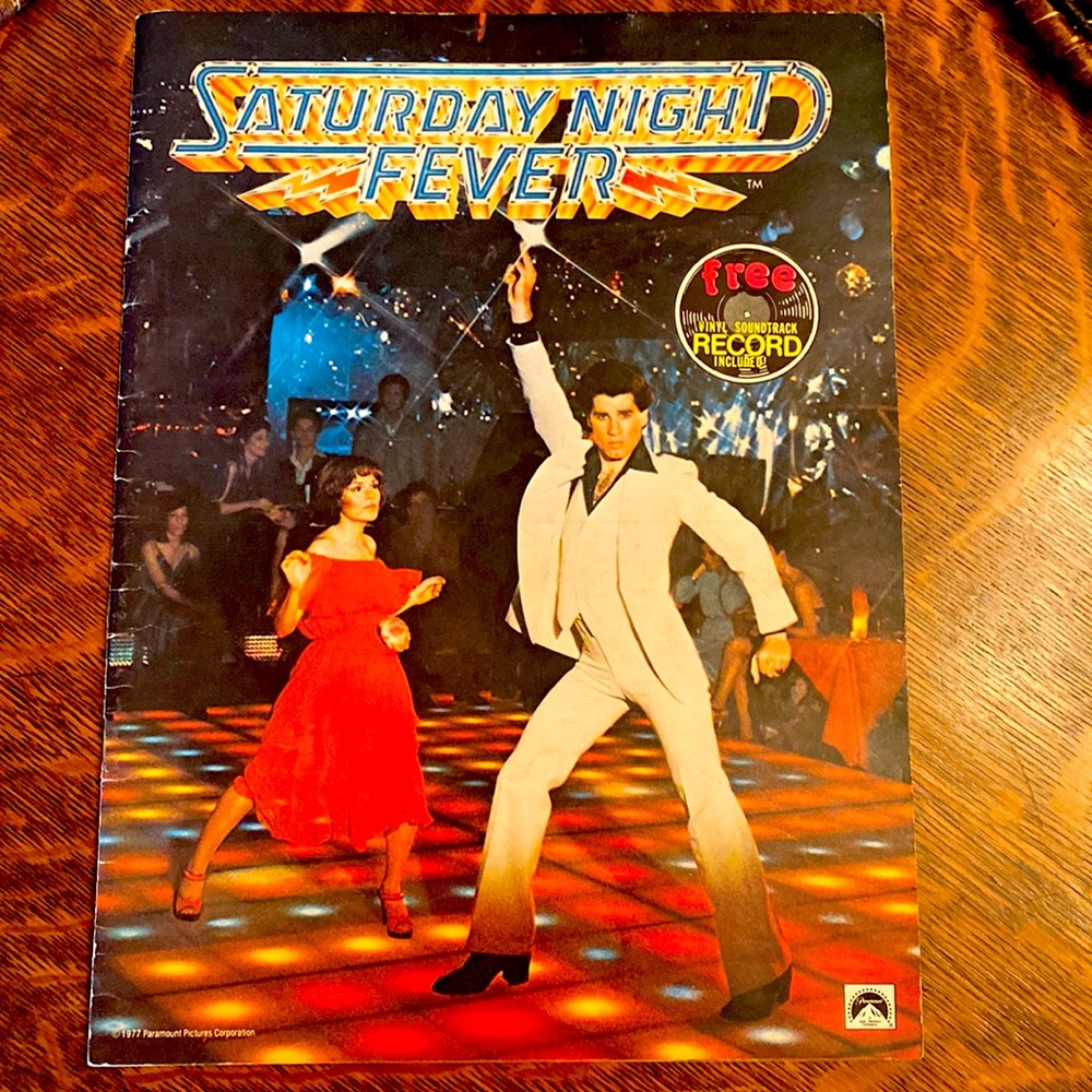 Saturday Night Fever book from 1977 with cast and music details.